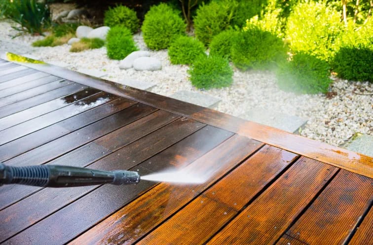 Pressure cleaning a wooden deck — restoring original color and texture